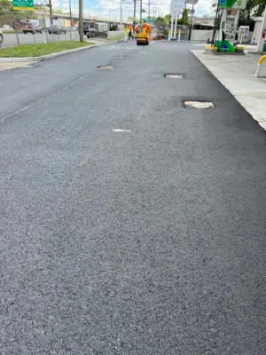 Paved drive aisle with flush access covers.