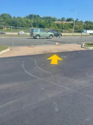 Yellow directional arrow at the forecourt exit.
