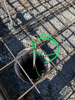 Containment chamber surrounded by reinforcing steel.