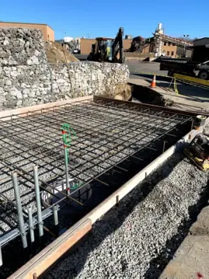 Reinforcing steel and timber formwork prepared for concrete placement.
