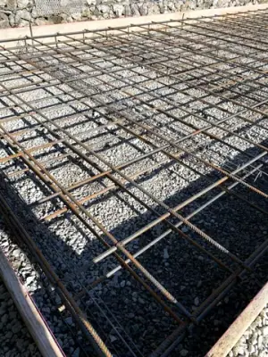 Reinforcing steel and timber formwork prepared for concrete placement.