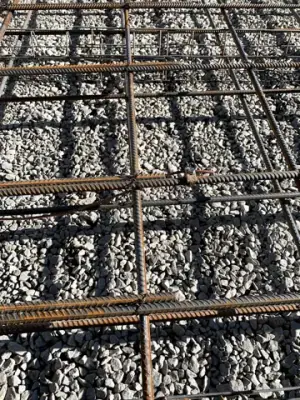 Reinforcing steel and timber formwork prepared for concrete placement.