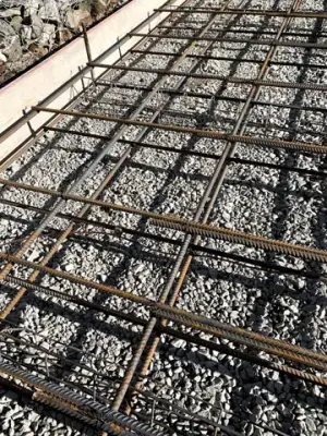 Reinforcing steel and timber formwork prepared for concrete placement.