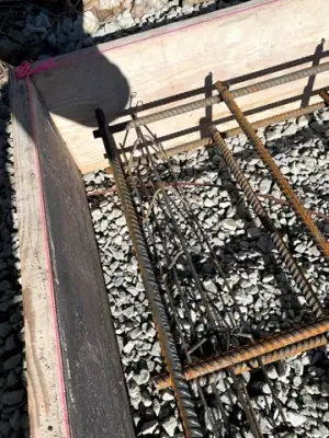 Reinforcing steel and timber formwork prepared for concrete placement.