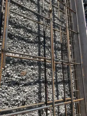 Reinforcing steel and timber formwork prepared for concrete placement.