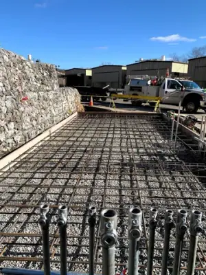 Reinforcing steel and timber formwork prepared for concrete placement.