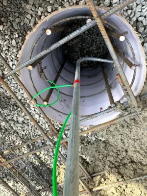 Open containment chamber with internal conduits and connections.