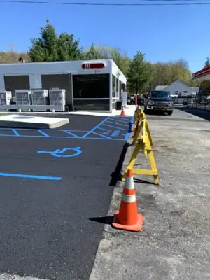 New accessible-parking markings beside the station building.
