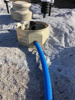 Blue piping connects to a tank containment sump.