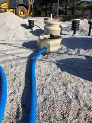 Blue piping connects to a tank containment sump.