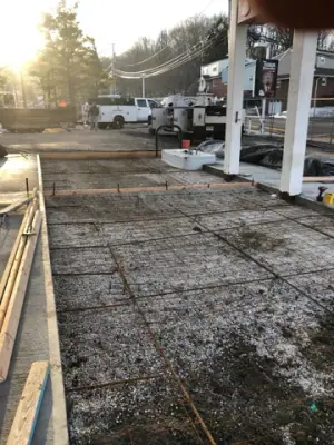Prepared concrete forms and reinforcement along the dispenser lane.