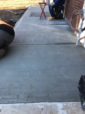 New concrete walkway outside the building.