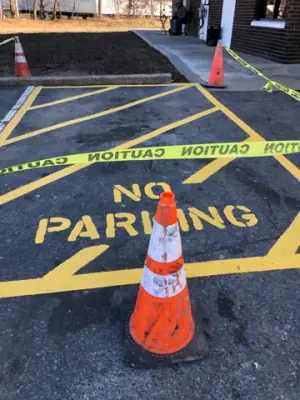 Yellow no-parking markings and crosshatching on the asphalt.