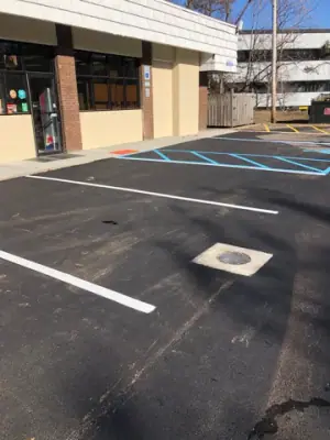 White parking-space lines in front of the building.